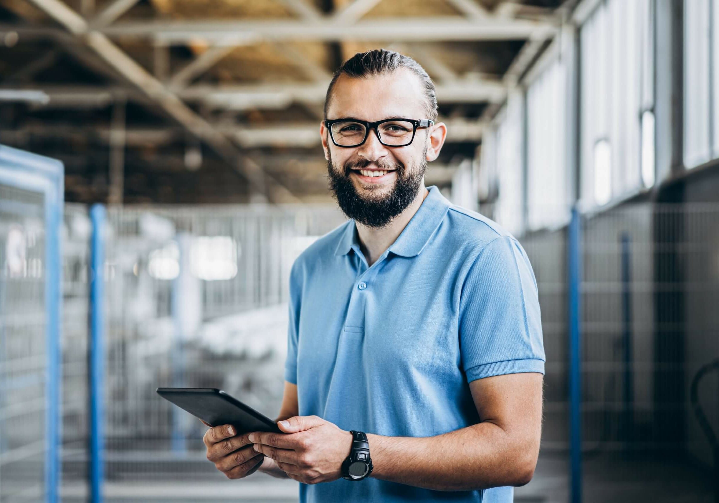 Asset Management Worker with Asset management Software on a Tablet