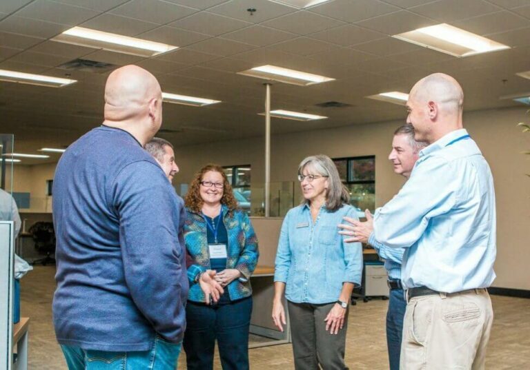 Blue Mountain staff discussing something in Blue Mountain Summit